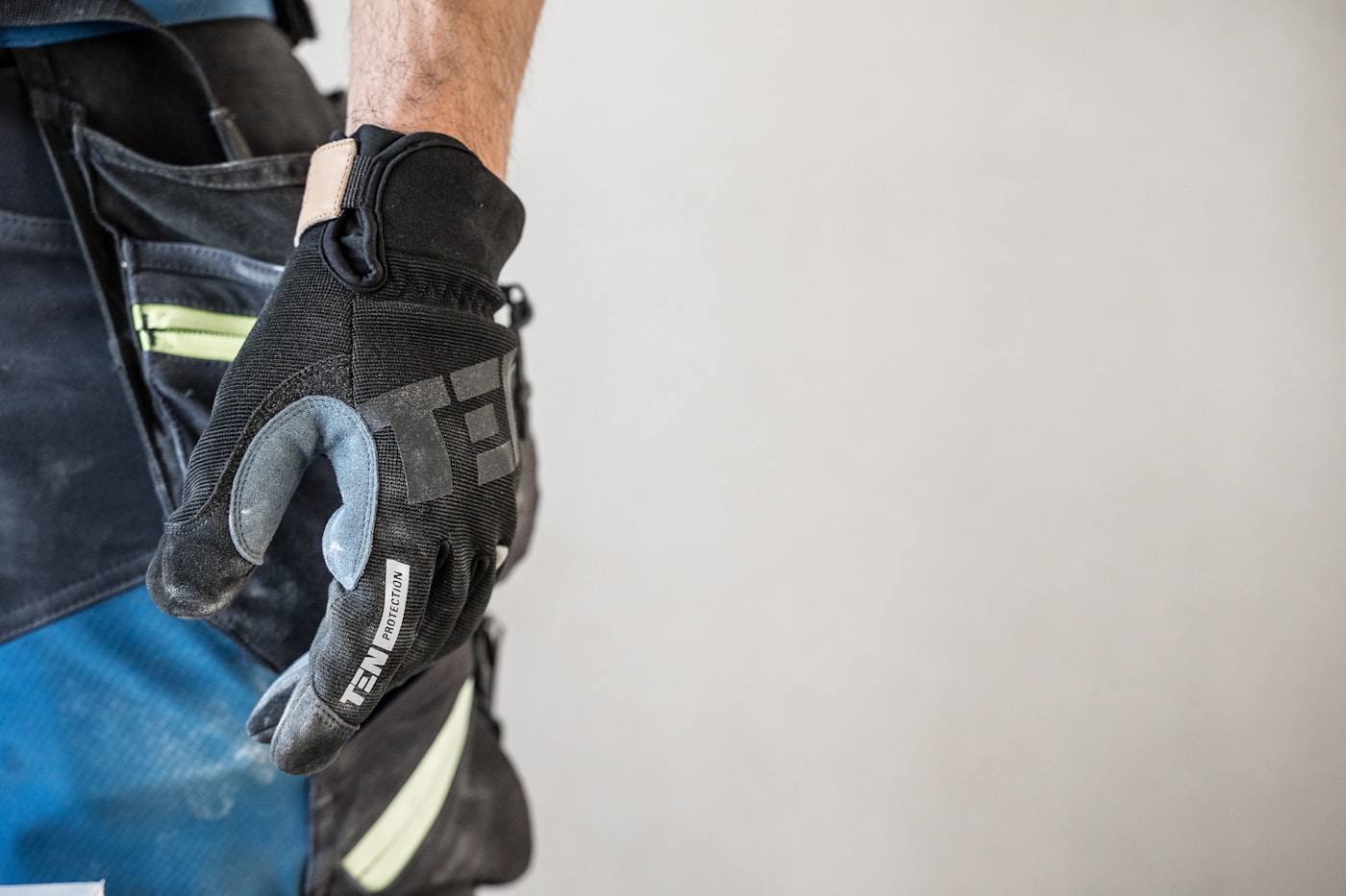 Close-up of a coated work glove on a job task