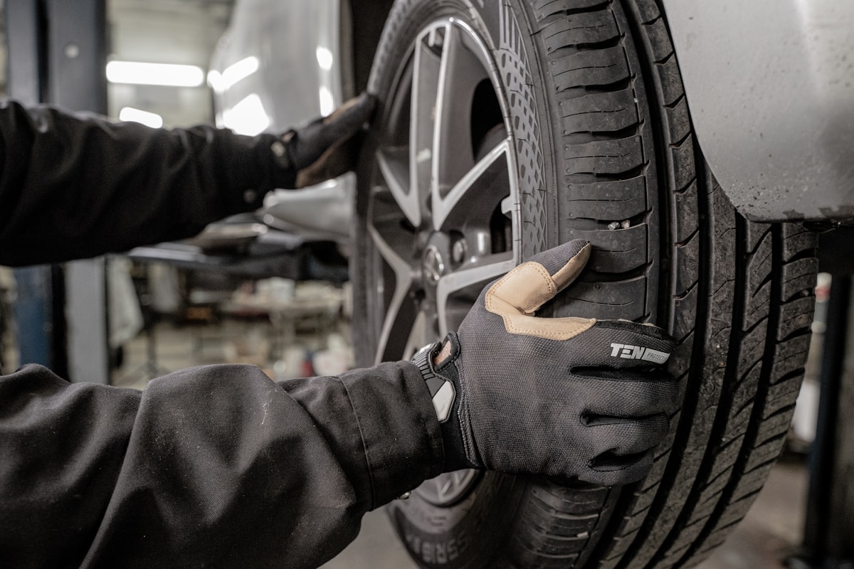 Mechanic working on a tire in a garage
